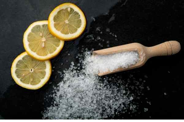 picture of sea salt and lemon on a plain surface