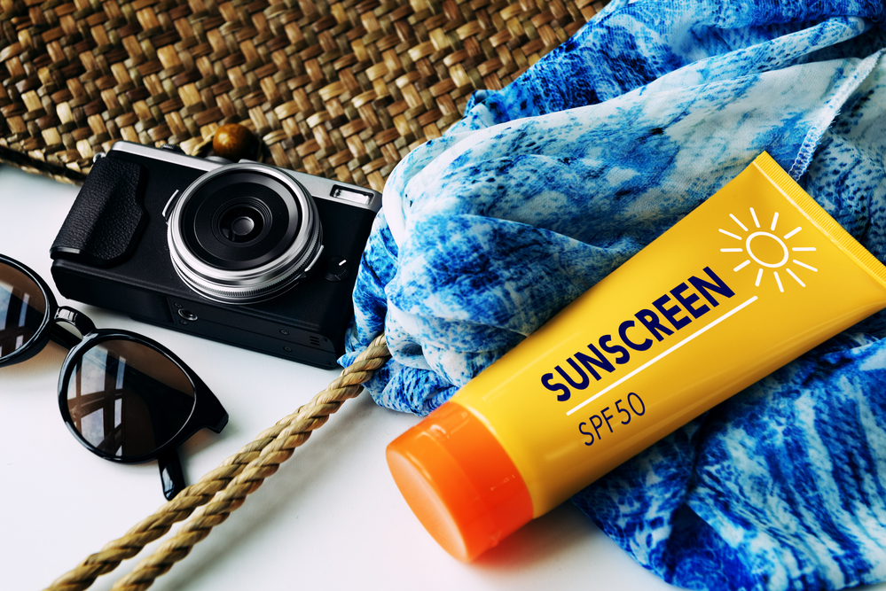 Packing Beach Camera Sunscreen Concept