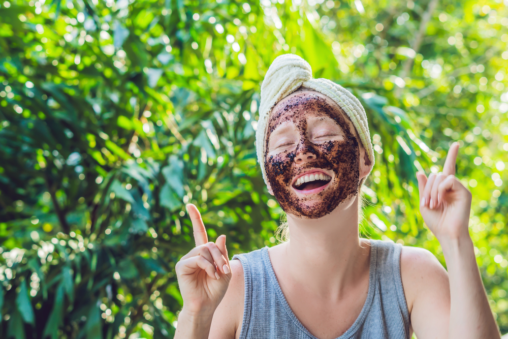 girl with coffee scrub on face