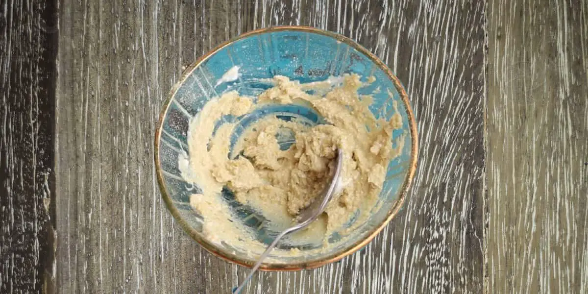 orange peel powder in a bowl mixed with yogurt